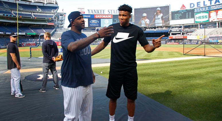 Milwaukee Bucks basketball player Giannis Antetokounmpo and Yankees pitcher CC Sabathia chat before the Yankees' game against the Tampa Bay Rays on July 15, 2019, at Yankee Stadium. Milwaukee Bucks basketball player Giannis Antetokounmpo and Yankees pitcher CC Sabathia chat before the Yankees' game against the Tampa Bay Rays on July 15, 2019, at Yankee Stadium.