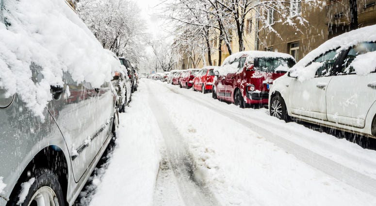 Cars on a snowy city street