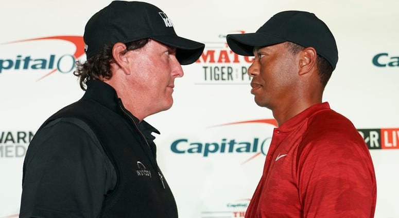 November 20, 2018; Las Vegas, NV, USA; Phil Mickelson (left) and Tiger Woods (right) pose for a photo during a press conference before The Match: Tiger vs Phil golf match at Shadow Creek Golf Course. Mandatory Credit: Kyle Terada-USA TODAY Sports November 20, 2018; Las Vegas, NV, USA; Phil Mickelson (left) and Tiger Woods (right) pose for a photo during a press conference before The Match: Tiger vs Phil golf match at Shadow Creek Golf Course. Mandatory Credit: Kyle Terada-USA TODAY Sports