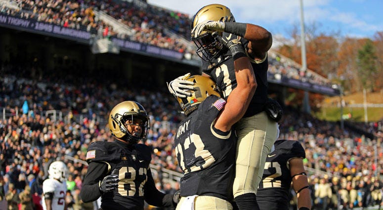 Army Black Knights running back Darnell Woolfolk (33) celebrates a touchdown with running back Jordan Asberry (3) against the Lafayette Leopards on Nov. 10, 2018, at Michie Stadium in West Point, New York. Army Black Knights running back Darnell Woolfolk (33) celebrates a touchdown with running back Jordan Asberry (3) against the Lafayette Leopards on Nov. 10, 2018, at Michie Stadium in West Point, New York.