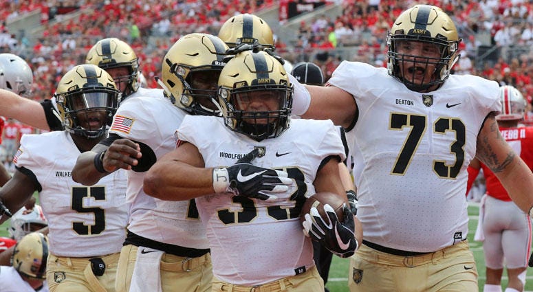 Army running back Darnell Woolfolk (33) celebrates a touchdown with teammates against Ohio State on Sept. 16, 2018, in Columbus, Ohio. Army running back Darnell Woolfolk (33) celebrates a touchdown with teammates against Ohio State on Sept. 16, 2018, in Columbus, Ohio.