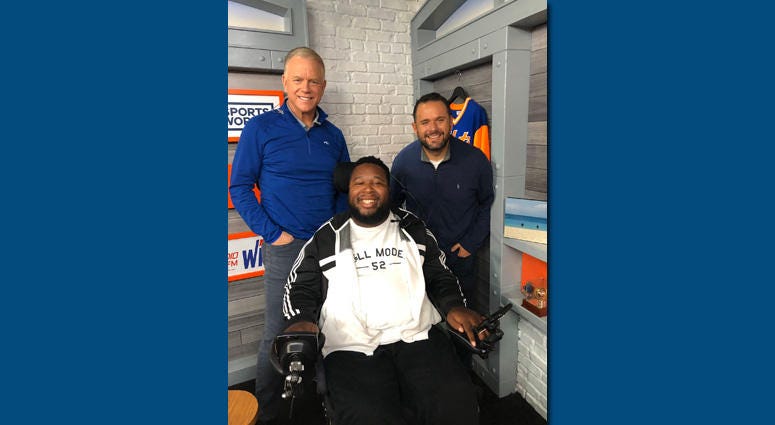 Eric LeGrand poses with Boomer and Gio. Eric LeGrand poses with Boomer and Gio.