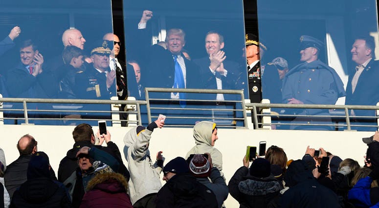 Donald Trump waves to the crowd from a suite during the Army-Navy football game at M&T Bank Stadium on Dec. 10, 2016, in Baltimore. Donald Trump waves to the crowd from a suite during the Army-Navy football game at M&T Bank Stadium on Dec. 10, 2016, in Baltimore.