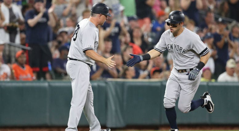 New York Yankees outfielder Mike Tauchman (39) congratulated by coach Phil Nevin (88) as he rounds the bases following his third inning solo home run against the Baltimore Orioles New York Yankees outfielder Mike Tauchman (39) congratulated by coach Phil Nevin (88) as he rounds the bases following his third inning solo home run against the Baltimore Orioles