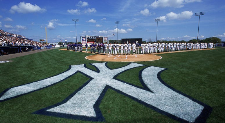 A general view of the players on the field during the national anthem before a spring training game between the Yankees and Blue Jays on March 2, 2001, at Legends Field in Tampa, Florida. A general view of the players on the field during the national anthem before a spring training game between the Yankees and Blue Jays on March 2, 2001, at Legends Field in Tampa, Florida.