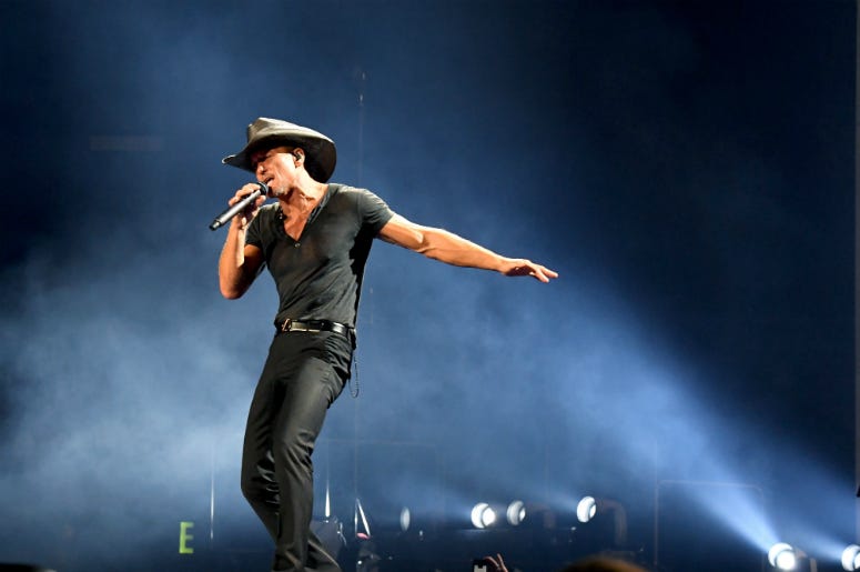 Tim McGraw performs onstage during the 'Soul2Soul' World Tour Tim McGraw performs onstage during the 'Soul2Soul' World Tour
