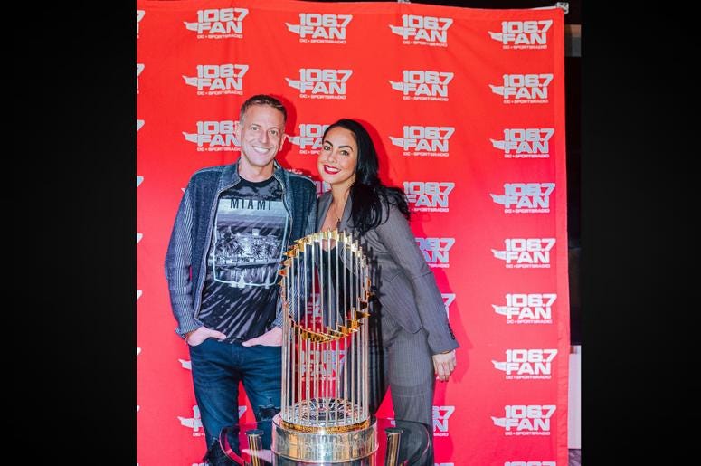 Jason and Corinna were pumped to see the trophy. Jason and Corinna were pumped to see the trophy.