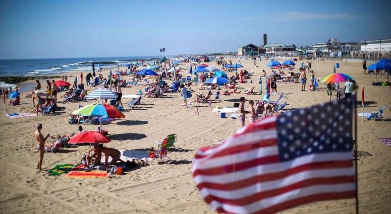 ASBURY PARK, NJ - MAY 26: People visit the beach during Memorial Day weekend on May 26, 2019 i