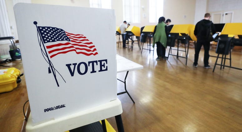 Voters prepare their ballots in voting booths during early voting for the California presidential primary election at an L.A. County 'vote center' on March 1, 2020 in Los Angeles, California.