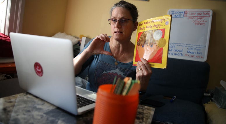 Leanne Francis, first grade teacher at Harvey Milk Civil Rights Academy, conducts an online class from her living room on March 20, 2020 Leanne Francis, first grade teacher at Harvey Milk Civil Rights Academy, conducts an online class from her living room on March 20, 2020
