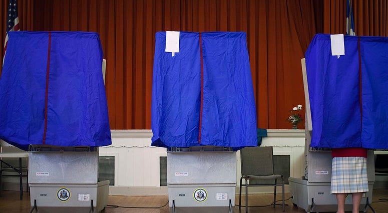 voter cast a ballot in a voting booth during the Republican primary election April 24, 2012 at St. George Greek Orthodox Church in Philadelphia, voter cast a ballot in a voting booth during the Republican primary election April 24, 2012 at St. George Greek Orthodox Church in Philadelphia,