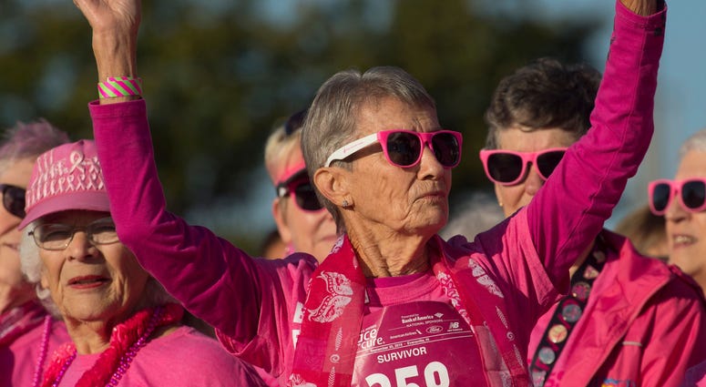 etty Singer, 87, of Evansville is acknowledged as a 47-year breast cancer survivor at the 2018 Susan G. Komen Race for the Cure at Eastland Mall Sunday morning.
