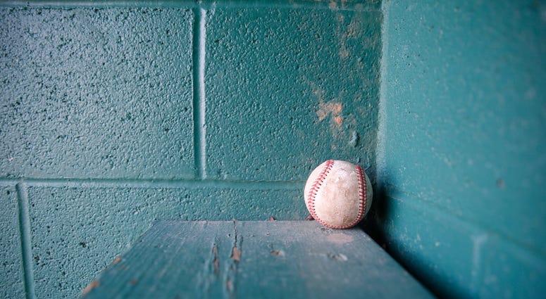 A baseball left inside a dugout at the baseball field at Maurer Geering Park on March 16, 2020. Empty Ball Fields