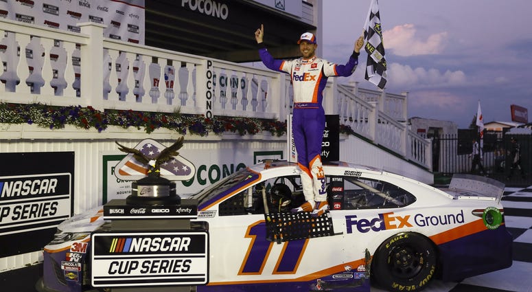 Jun 28, 2020; Long Pond, Pennsylvania, USA; Denny Hamlin celebrates in victory lane after winning the Pocono 350 Cup Series at Pocono Raceway.