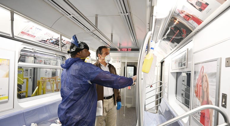 Cuomo disinfects a 7 train car in Queens. Cuomo disinfects a 7 train car in Queens