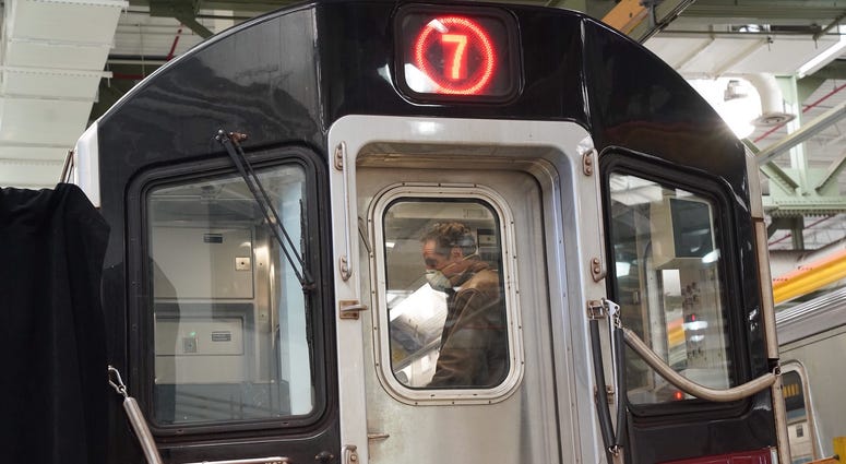 Cuomo disinfects a 7 train car in Queens. Cuomo disinfects a 7 train car in Queens
