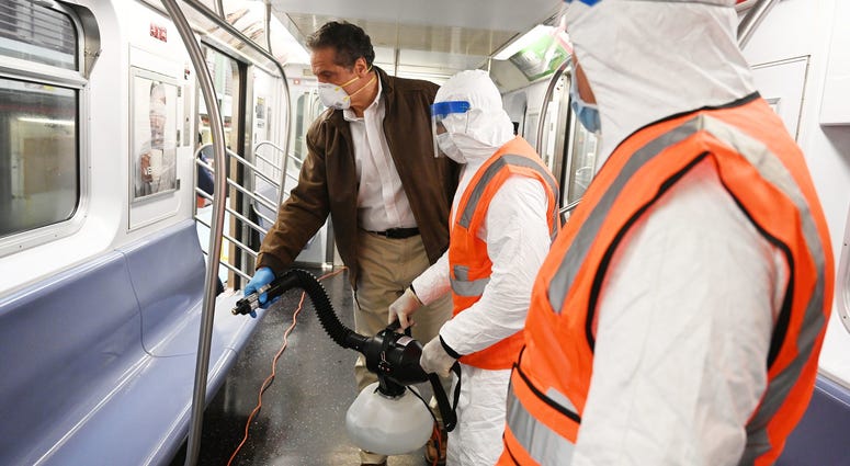 Cuomo disinfects a 7 train car in Queens. Cuomo disinfects a 7 train car in Queens
