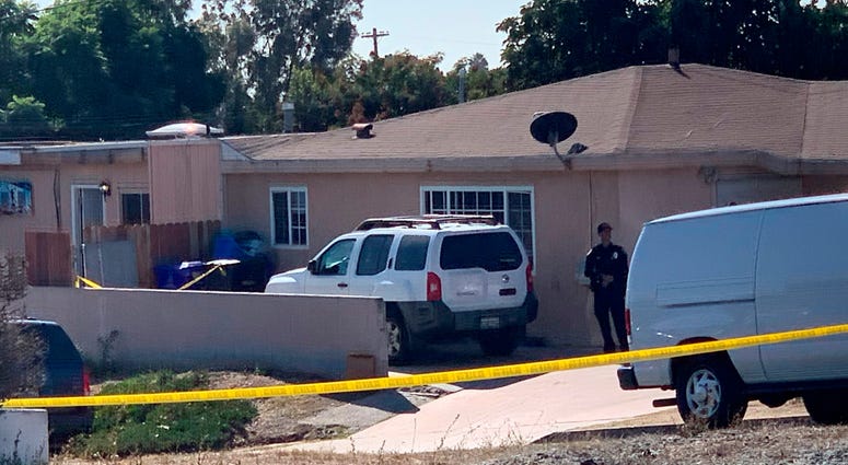 San Diego police investigate a shooting that killed five members of a family and wounded one more in Paradise Hills on Saturday, Nov. 16, 2019 in San Diego, Calif. San Diego shooting