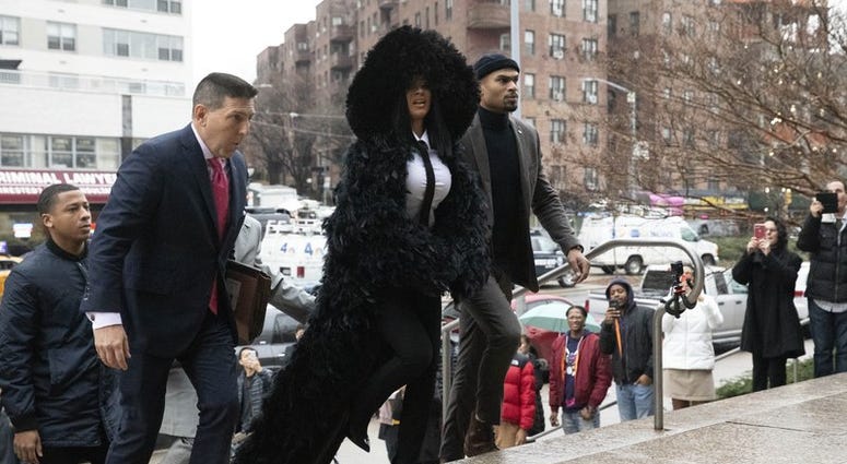 Rapper Cardi B arrives at Queens Criminal Court on charges stemming from an 2018 fight at a Queens strip club, Tuesday, Dec. 10, 2019 in New York. Prosecutors obtained a felony indictment in June. (AP Photo/Mark Lennihan) Rapper Cardi B arrives at Queens Criminal Court on charges stemming from an 2018 fight at a Queens strip club, Tuesday, Dec. 10, 2019 in New York. Prosecutors obtained a felony indictment in June. (AP Photo/Mark Lennihan)