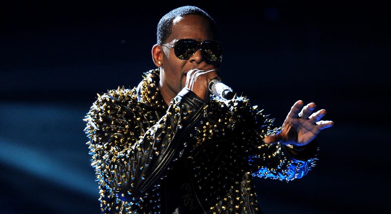 In this June 30, 2013, file photo, R. Kelly performs onstage at the BET Awards at the Nokia Theatre in Los Angeles. R. Kelly