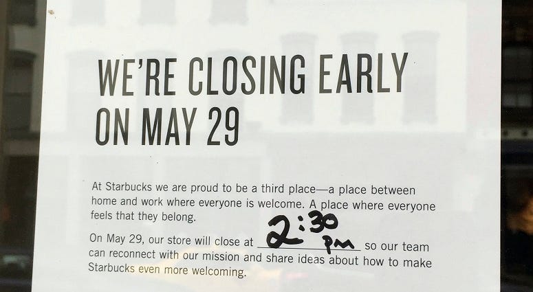This Sunday, May 27, 2018, photo shows a sign displayed at a Starbucks cafe in Portland, Maine, reminding customers that the store will be closed Tuesday for training. Starbucks Anti-Bias Training