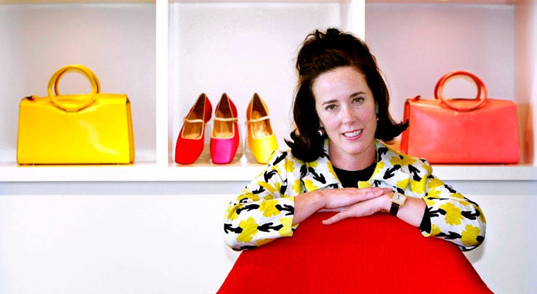In this May 13, 2004 file photo, designer Kate Spade poses with handbags and shoes from her next collection in New York. Kate Spade