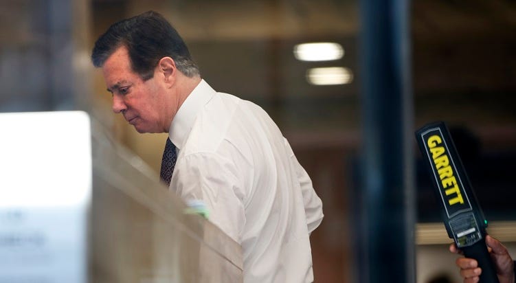 Paul Manafort goes through security as he arrives at federal court, Friday, June 15, 2018, in Washington. Paul Manafort