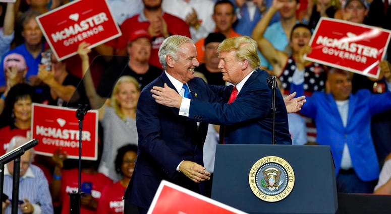 President Donald Trump greets Gov. Henry McMaster