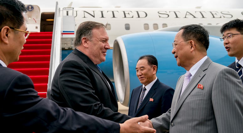 In this July 6, 2018, file photo, U.S. Secretary of State Mike Pompeo, second from left, is greeted by North Korean Director of the United Front Department Kim Yong Chol, center, and North Korean Foreign Minister Ri Yong Ho, second from right, as he arriv Mike Pompeo