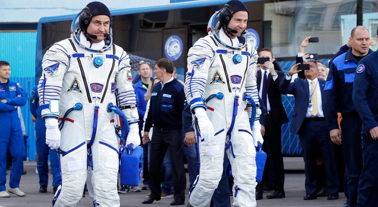 U.S. astronaut Nick Hague, right and Russian cosmonaut Alexey Ovchinin