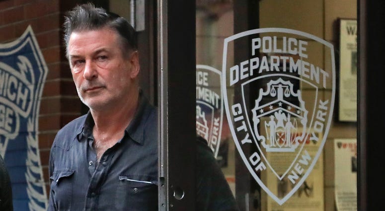 Actor Alec Baldwin walks out of the New York Police Department's 10th Precinct, Friday, Nov. 2, 2018, in New York. Baldwin was arrested Friday after allegedly punching a man in the face during a dispute over a parking spot outside his New York City home, alec baldwin punch