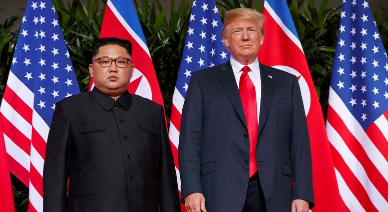 In this June. 12, 2018, file photo, U.S. President Donald Trump, right, meets with North Korean leader Kim Jong Un on Sentosa Island, in Singapore. Trump and Kim Jong Un