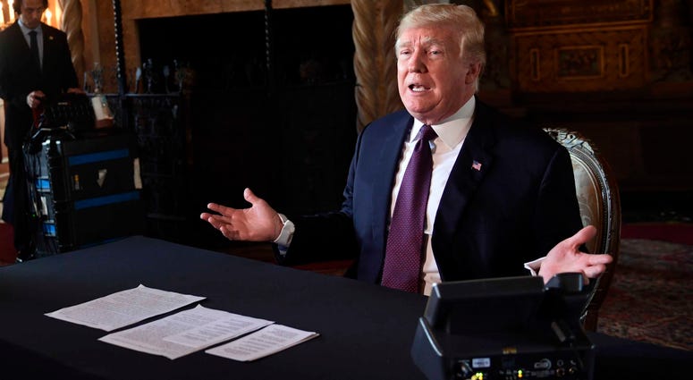 President Donald Trump speaks to reporters following his teleconference with troops from his Mar-a-Lago estate in Palm Beach, Fla., Thursday, Nov. 22, 2018. Trump