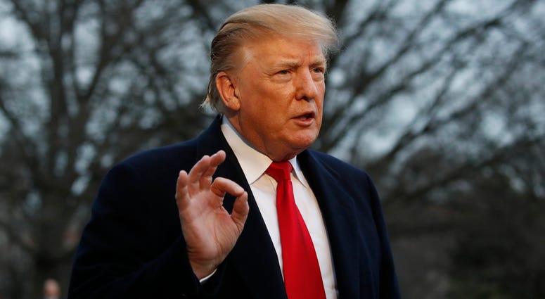 President Donald Trump speaks with the media after stepping off Marine One on the South Lawn of the White House, Sunday, March 24, 2019, in Washington. President Donald Trump