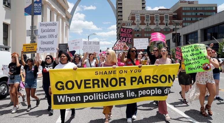 Abortion-rights supporters march Thursday, May 30, 2019, in St. Louis. A St. Louis judge heard an hour of arguments Thursday on Planned Parenthood's request for a temporary restraining order Abortion-rights supporters march Thursday, May 30, 2019, in St. Louis. A St. Louis judge heard an hour of arguments Thursday on Planned Parenthood's request for a temporary restraining order