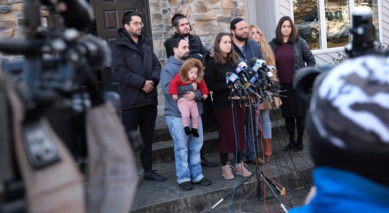 Surrounded primarily by family, Nicky Kohen, the daughter of Josef Neumann who was critically injured in an attack on a Hanukkah celebration, speaks to reporters in front of her home in New City, N.Y., Thursday, Jan. 2, 2020. Surrounded primarily by family, Nicky Kohen, the daughter of Josef Neumann who was critically injured in an attack on a Hanukkah celebration, speaks to reporters in front of her home in New City, N.Y., Thursday, Jan. 2, 2020.