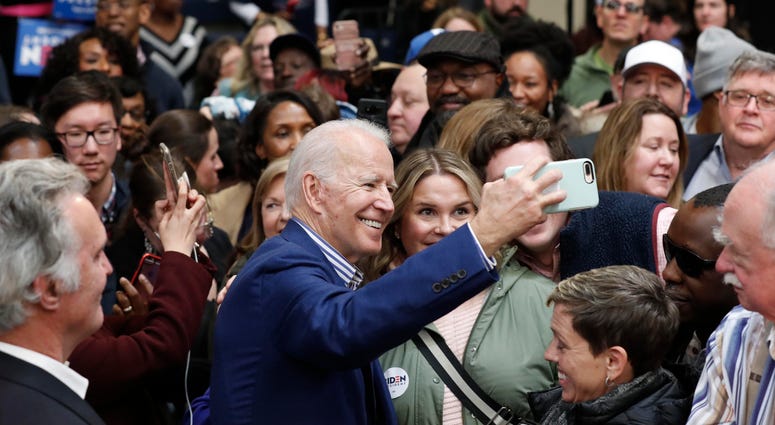 Democratic presidential candidate former Vice President Joe Biden takes photos with supporters at a campaign event at Saint Augustine's University in Raleigh, N.C., Saturday, Feb. 29, 2020. Joe Biden