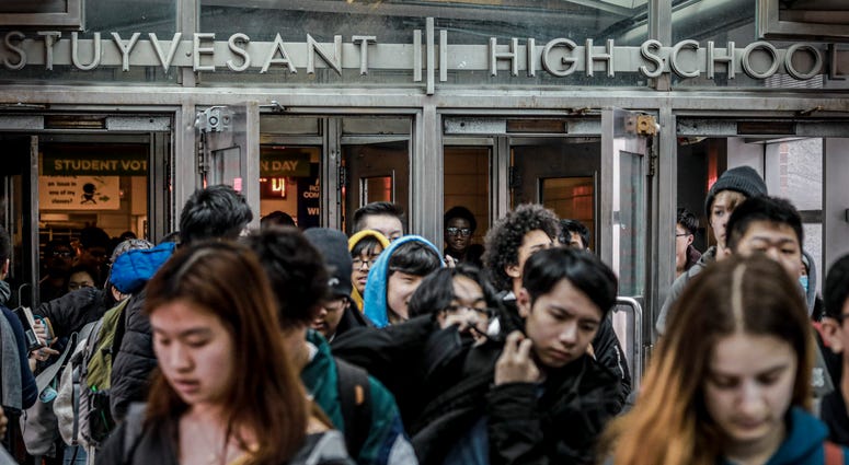 Students at Stuyvesant High School leave after classes end for the week, Friday, March 13, 2020, Stuyvesant High School