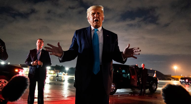 President Donald Trump talks with reporters at Andrews Air Force Base after attending a campaign rally in Latrobe, Pa., Thursday, Sept. 3, 2020, at Andrews Air Force Base, Md. Trump