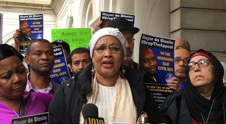 Activists and the mother of Mohamed Bah urge the city to drop a verdict appeal. Activists and the mother of Mohamed Bah urge the city to drop a verdict appeal.