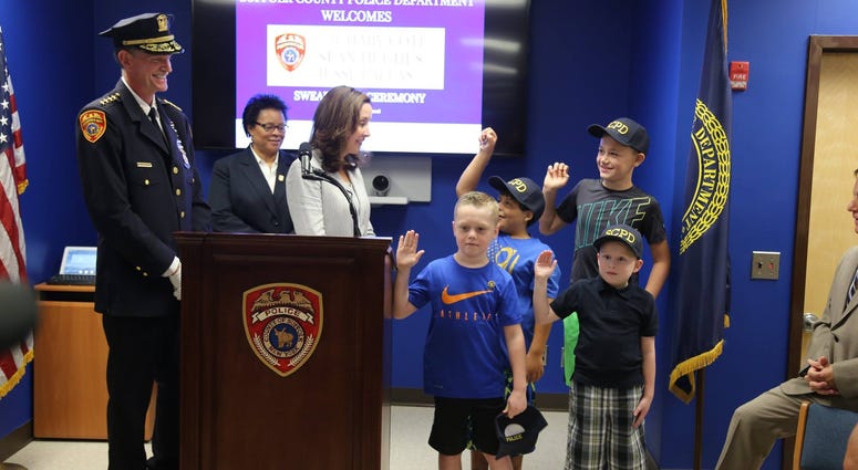 Three boys battling cancer were sworn in as police officers for the day in Suffolk County Three boys battling cancer were sworn in as police officers for the day in Suffolk County