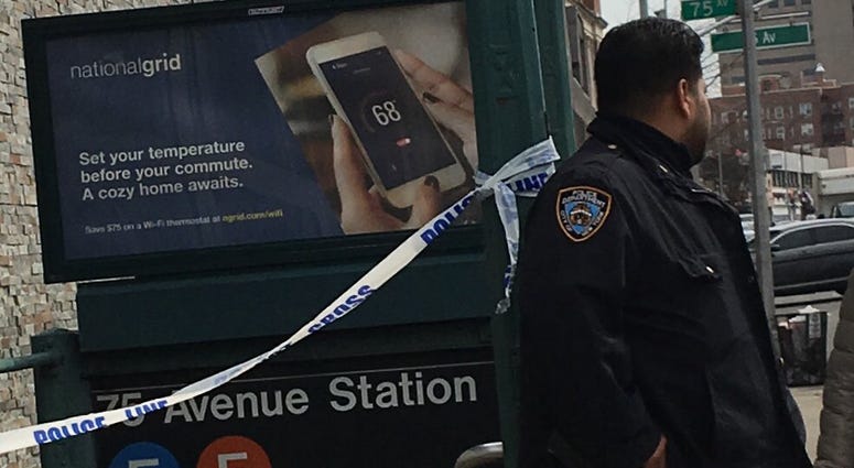 Police on the scene in Queens where a gunshot victim dragged himself off an F train. Police on the scene in Queens where a gunshot victim dragged himself off an F train.