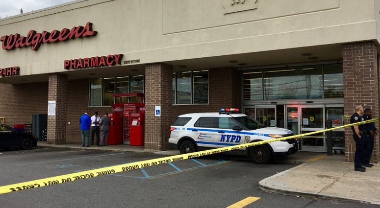 Police investigate an armed robbery at a Walgreens in Queens Walgreens Armed Robbery