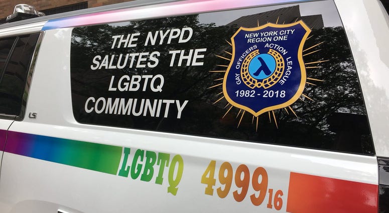 A police van decorated in a rainbow for the NYC LGBT Pride March. NYPD Gay Pride