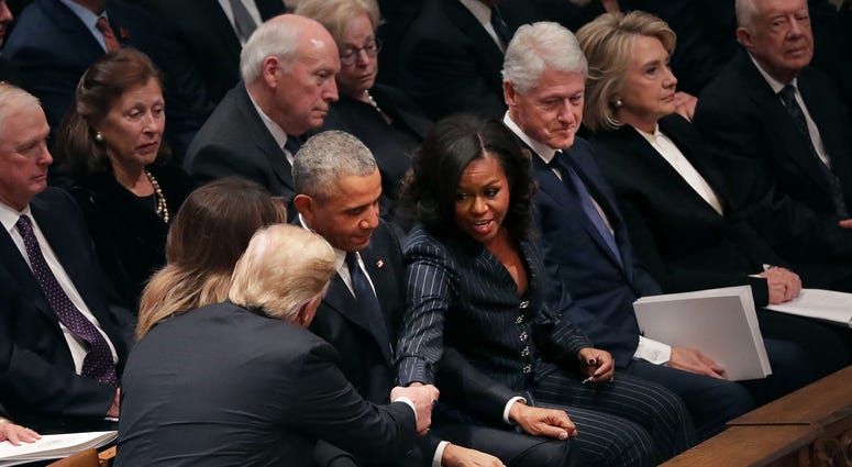 President Donald Trump and first lady Melania Trump greet former President Barack Obama and Michelle Obama as they join other former presidents and vice presidents and their spouses for the state funeral for former President George H.W. Bush. George H.W. Bush