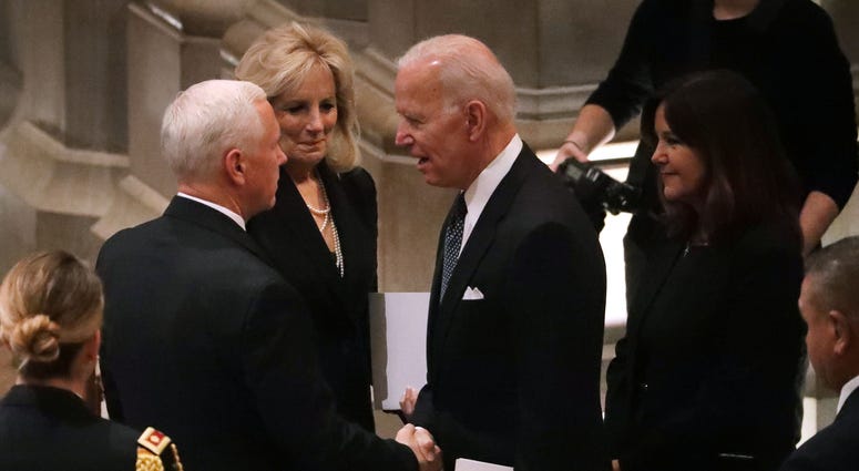 Vice President Mike Pence (L) talks with former Vice President Joe Biden and Jill Biden during the state funeral for former President George H.W. Bush at the National Cathedral December 05, 2018 in Washington, DC. George H.W. Bush