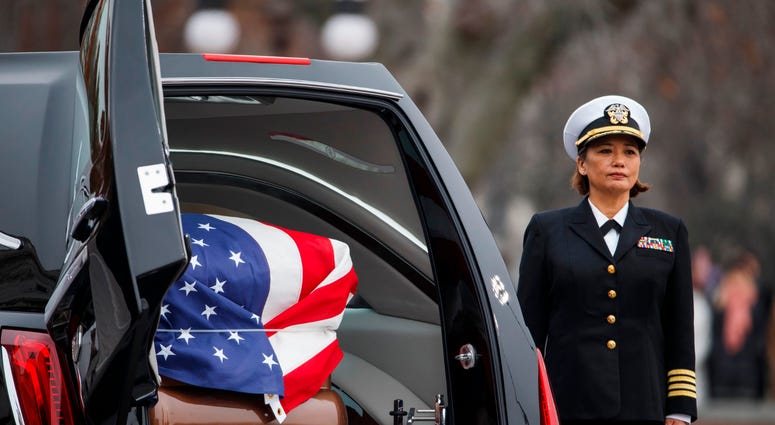 The casket of former US President George H.W. Bush sits in the hearse on the East Front of the US Capitol on December 5, 2018 in Washington, DC. George H.W. Bush