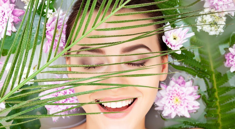 Woman surrounded by flowers