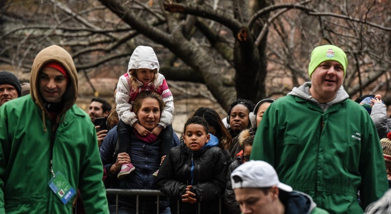 Spectators watch the Macy's inflation team as they inflate the giant balloons for the Macy's Thanksgiving Day Parade on November 21, 2018 in New York City. Thanksgiving Parade