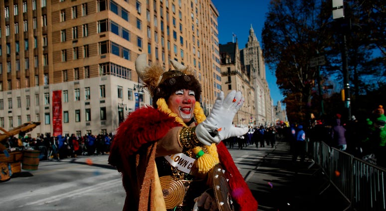 A parade participant dressed in costume waves to the crowd along the route during the 92nd annual Macy's Thanksgiving Day Parade on November 22, 2018 in New York City. Thanksgiving Day Parade 2018
